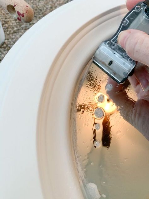 Learn how to paint a mirror the easy way! This how-to guide walks through the simple steps to paint a mirror without removing the frame and without worry about getting paint on the mirror. Upcycle old mirrors or give a mirror you love a refresh using paint. This painted white mirror got a makeover using a Zibra square brush and The Chippy Barn Paint in Cottage White to give it a bright, farmhouse white décor style. #megdeldesign #painteddecor #diydecor #paintedmirror #whitemirror #... Oval Mirror Makeover Diy, Mirror Frame Makeover, Paint A Mirror, Mirror Makeover Diy, Mirror Upcycle, Bright Farmhouse, Painting Mirror Frames, Round Mirror Frame, Porthole Mirror