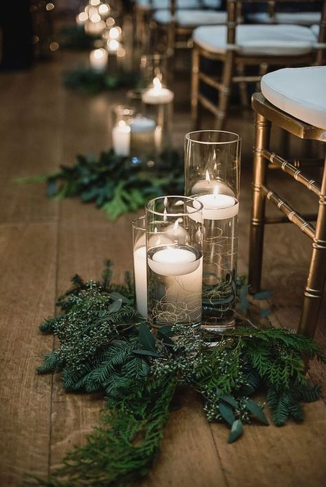 evergreen and greenery arrangements with floating candles in tall vases are nice to accent your wedding aisle Christmas Wedding Themes, Winter Wedding Centerpieces, Christmas Wedding Decorations, Winter Wedding Decorations, December Wedding, Winter Wedding Inspiration, Winter Wonderland Wedding, בר מצווה, Wedding Boho