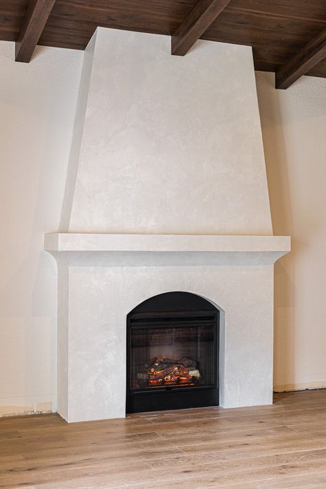 Plaster Fireplace Hearth, Decor On Either Side Of Fireplace, Plaster Corner Fireplace, White Venetian Plaster Fireplace, Diy Venetian Plaster Fireplace, White Venetian Plaster Walls, Mediterranean Style Fireplace, Venetian Fireplace, Plaster Over Brick Fireplace