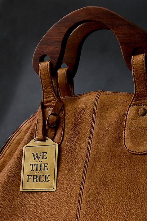 Oversized slouchy leather tote in a throwback silhouette featuring wooden top handles. * Detachable shoulder strap * Lined interior with slip pockets * Zipper closure | We The Free Willow Vintage Tote Bag at Free People in Brown Slouchy Leather Tote, Vintage Tote Bag, Large Leather Tote Bag, Oversized Bag, Large Leather Tote, Handbag Heaven, Leather Handbags Tote, Bags Designer Fashion, Leather Hobo