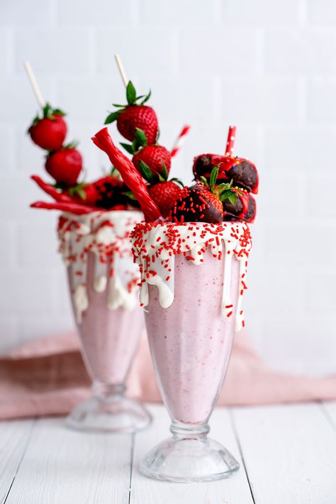 Amazing Strawberry Freakshakes Extreme Milkshakes Recipe with Donuts, Chocolate Covered Strawberries, White Chocolate, Sprinkles and the best classic strawberry milkshake recipe! #Recipe #Milkshakes Extreme Milkshakes, Milkshake Recipe Strawberry, Chocolate Milkshake, Milkshake Recipes, Strawberry Milkshake, Milk Shakes, Milk Shake, Julia Child, Dessert Cups