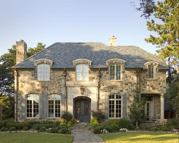 French Eclectic Style with broken eave arched dormers.   Note how the elevation is not symmetrical but maintains balance with symmetrical elements.  Unique here also is the use of the stone.  Copper gutters and a slate roof along with the cast stone entrance define a highly sophisticated but rustic design. French Country Exterior Homes, Normandy House, Residence Architecture, Architecture Reference, French Country Exterior, Country Mansion, French Exterior, Country House Design, French Style Homes