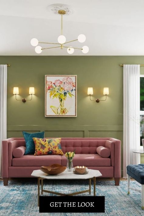 A floral art on a green accent wall. Sofa Wall Decor Behind Couch, Sconces Above Couch, Decor Ideas Above Couch, Ideas Above Couch, Wall Behind Sofa, Vintage Living Room Design, Primrose Mirror, Eclectic Living Room Design, Living Room Wall Decor Ideas