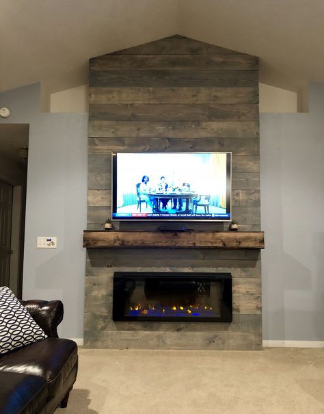 Weathered Grey rustic farmhouse style fireplace wall. Vaulted ceiling, electric fireplace, floating mantle, tv above fireplace. #thedeckerator Diy Tv Wall, Above Fireplace Ideas, Tv Above Fireplace, Tv Over Fireplace, Electric Fireplace Wall, Farmhouse Room, Fireplace Tv Wall, Tv Wall Mount, Farmhouse Fireplace