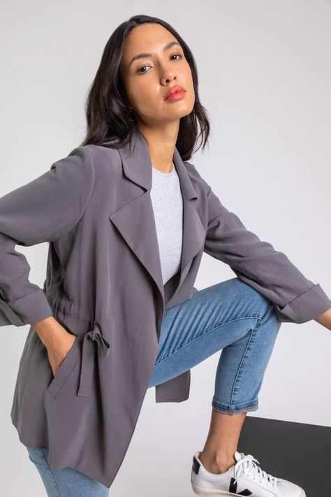 Tie Waist Longline Jacket - Free UK Delivery - 6 8 10 12 14 16 18 20 22 24 26 - Your new staple piece to add to your spring/summer wardrobe, this jacket is perfect for the new season. Featuring long sleeves that can be turned up with buttoned tabs, this lightweight jacket has a lovely gathered waist with tie detail and has been cut to a classic longline shape. Wear with any of your everyday outfits as a lightweight cover or throw on over jumpers for an additional layer wh Spring Summer Wardrobe, Drawstring Jacket, Longline Jacket, Waist Jacket, Travel Clothes Women, Shape Wear, Grey Tie, Summer Jacket, Light Jacket