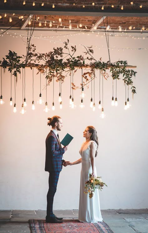 Edison lights hang overhead on this industrial wedding ceremony installation. Here are 6 Ideas for your Industrial Wedding Arch from Here Comes The Guide! #industrialchic #industrialwedding Industrial Wedding Arch, Industrial Wedding Ceremony, Ceremony Arch Decor, Wedding Layout, Bridal Things, Industrial Chic Wedding, Wedding Ceremony Arch, Ceremony Design, Party Tips