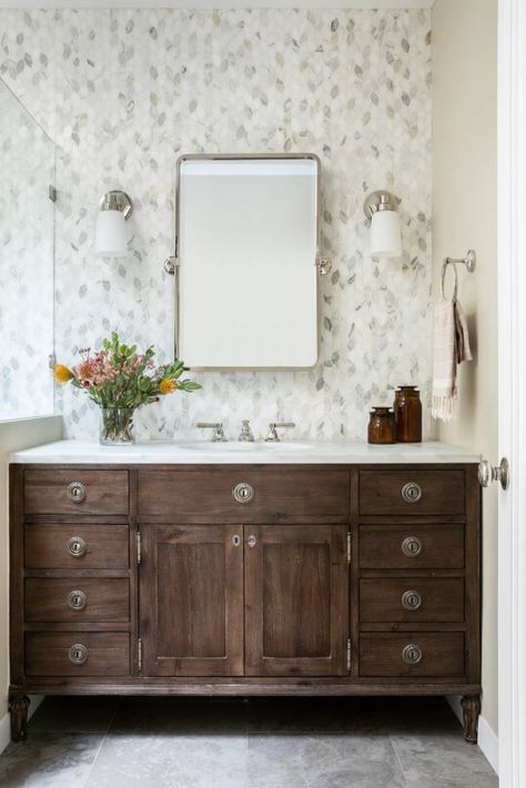 Want to redesign your master bathroom? I recently worked on one that underwent a major transformation! It started with old, outdated tiles and we transformed it with a grey mosaic tile and dark wooden cabinets to give it a fresh, classic look. Check out the entire transformation! Bathroom With Dark Cabinets, Bathroom Lighting Ideas, Beautiful Bathroom Vanity, Grey Mosaic, Beautiful Bathroom Designs, Wallpaper Bathroom, Dream Master, Bathroom Transformation, Wall Inspiration