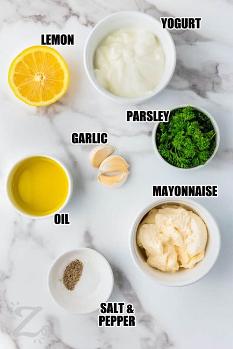 For a versatile go-to dip or dressing that tastes great on salads, bread, and vegetables, try this easy garlic sauce recipe. This Papa Johns copycat is made in just five minutes by blending fresh garlic cloves with mayonnaise, yogurt, lemon juice, olive oil, and herbs. Use it as a dip for pizza crust, but don’t stop there! Rich and tangy garlic sauce tastes amazing on vegetables and sandwiches or as a dip for chips or pretzels. #garlicsauce #garlicsaucerecipe #ourzestylife #garlicsauceforpizza Garlic Sauce For Pizza, Olive Oil Salad Dressing, Olive Oil Mayonnaise, Easy Truffles, Garlic Pizza, Garlic Sauce Recipe, Aioli Recipe, Garlic Dip, Salad Dressing Recipes Homemade