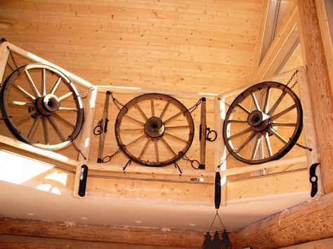 cabin_railing. Cabin Railing, Banister Remodel, Banister Rails, Wagon Wheel Decor, Loft Railing, Stair Banister, Wagon Wheels, Ships Wheel, Entry Stairs