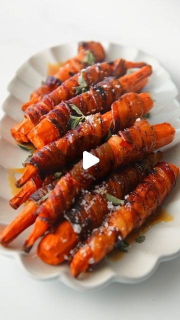 Patricia Martinescu on Instagram: "Hot Honey Bacon Wrapped Carrots. This side dish will complement everything on your holiday table this year. The natural sweetness of the roasted carrots pairs perfectly with the salty, crispy bacon and glazed with hot honey until caramelized. The flavor combination is sooooo gooooood.   Tag a bacon lover below! Recipe is on my site - bakecookrepeat.com or comment “bacon” on this post and I’ll send the link directly to your inbox. 💌  . . . . #bacon #carrots #baconwrapped #crispy #thanksgivingdinner #sides #easyrecipes #recipe #holidayrecipes #roastedveggies #recipeideas #appetizers #quickrecipes" Bacon Wrapped Carrots, Hot Honey Bacon, Bacon Carrots, Honey Bacon, Carrot Dishes, Bacon Lover, Hot Honey, Veggie Side Dishes, Thanksgiving Ideas