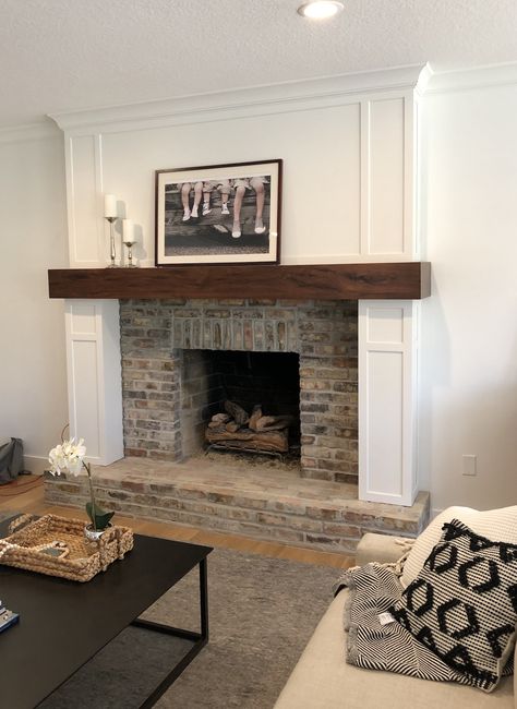 Painted Brick Fireplace With Wood Paneling, Brick And Wood Mantle Fireplace, Wood Top Fireplace, Fireplace Makeover Wood Mantle, Wood Panel Above Fireplace, Fireplace With Rustic Wood Mantle, Wood And White Fireplace, White Fireplace Surround Wood Mantle, White Fireplace With Dark Wood Mantle