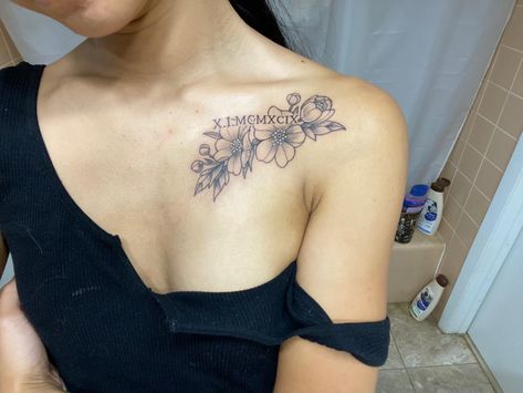 Roman Numeral Tattoo With Birth Flower, Sunflower Tattoo With Roman Numerals, Roman Numeral Flower Tattoo, Flower Roman Numeral Tattoo, Roman Numeral Floral Tattoo, Roman Numeral Tattoo With Lily, Gladiolus Tattoo Collar Bone, Flowers With Roman Numerals Tattoo, Collarbone Tattoo Roman Numerals