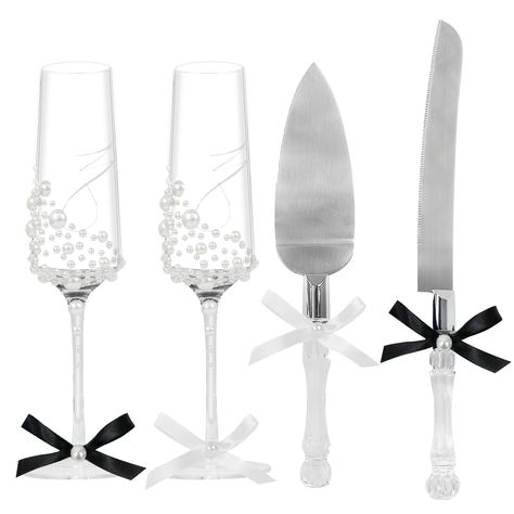 PRICES MAY VARY. 【Elegant Glasses and Knives Set】: Includes 1 cake serrated knife, 1 cake server, and 2 wedding toasting flutes that feature a ribbon and pearl embellishment.These elegant champagne glasses will add a touch of glamour to your special day and make your toast truly memorable. 【Personality & Perfectly】-If you’re looking for something classic and chic, our silvery pearl set is perfect. The champagne flutes are made of glass and feature a elegant silk bow and pearl embellishment, whil Bride And Groom Champagne Flutes, Pearl Champagne Flutes, Wedding Utensils, Bride And Groom Wine Glasses, Elegant Glasses, Wedding Cake Server Set, Cake Knife Set, Serrated Knife, Toasting Flutes Wedding