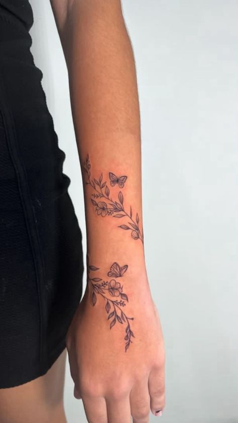 Womens Wrap Tattoo, Tattoos For Outer Forearm, Wrapping Wildflower Vine Tattoo, Flower Tattoo Designs For Women Arm, Tattoo Ideas Female First Time, Flowers Around Words Tattoo, Forearm Vine Tattoo Women, Rap Around Tattoo Arm, Vine Around Wrist Tattoo