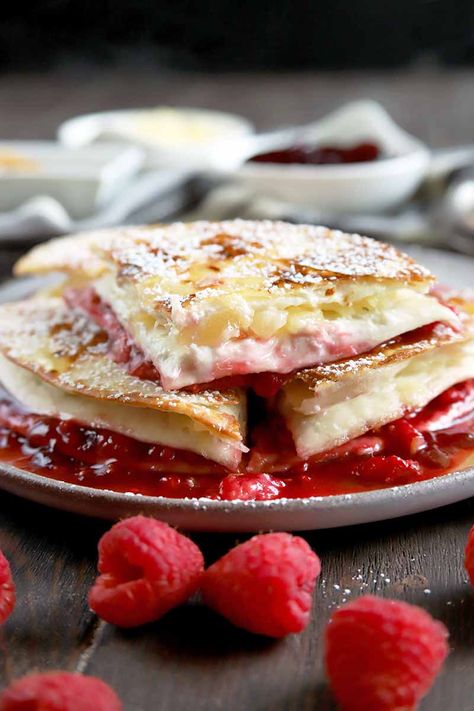 Think quesadillas are a savory treat just to be enjoyed for lunch or dinner? Think again! Our sweet raspberry, pineapple, and cream cheese version makes a delicious dessert. Get the recipe on Foodal. #quesadilla #dessert #foodal Sweet Quesadilla, Fruit Quesadilla, Dessert Quesadilla Recipes, Quesadilla Maker Recipes, Dessert Quesadilla, American Meals, Quesadilla Recipes Easy, Bread Puddings, Vegan Cinnamon Rolls