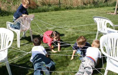 Kid-Sized Spider Web... have them weave a web by standing in a circle and tossing a ball of string all around(that's half the fun) and then secure edges to chairs. Toss and spider toy into the middle and see if they can retrieve the toy without touching the web. Reward with a spider-themed treat. Spider Web Game, Fun Halloween Games For Kids, Giant Spider Web, Toe Up Socks, Halloween Party Activities, Fun Halloween Games, Spider Toy, Perfect Halloween Party, Halloween Games For Kids