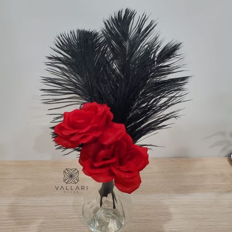 This centerpiece is the perfect addition to your Hollywood or Great Gatsby themed party! For Tables! I can also do this for other size vases. Let me know what you are looking for in the personalization section at checkout! This centerpiece will include:  1- Small Bud Vase  3 pc 12-14" Feathers (can choose Color of feathers from the drop down list) 2pc Roses stems You can always Mix and Match!  Note: These will need to be assembled! Contact me if you have any questions! :) Visit Our Etsy Page for Black White And Red Centerpieces, Harlem Nights Theme Centerpieces, Hollywood Table Centerpieces, Mascarade Party Decor, Gatsby Party Centerpieces, Red And Black Centerpieces, Black Tie Party Decorations, Feather And Roses Centerpieces, Black Feather Centerpieces