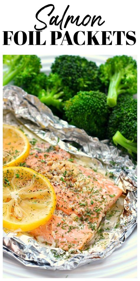 Salmon with lemon in juices sitting on foil. Oven Baked Fish Recipes Foil Packets, Salmon And Broccoli Foil Packets, Tin Foil Salmon Oven, Baked Salmon Foil Packets, How To Cook Salmon In The Oven In Foil, Salmon Foil Packets Oven With Broccoli, Salmon Aluminum Foil Recipe, Oven Salmon Recipes Foil Packets, Foil Packets For The Oven Salmon