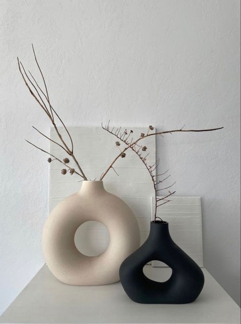 White vase in a shape of a circle with a hole inside, black vase in a shape of a tringle with a hole inside Japandi Decorative Objects, Japandi Vase Decor, Japandi Console, Japandi Accessories, Japandi Vase, Artifacts For Home Decor, Funky Vases, Japandi Home Decor, Modern Decorative Objects