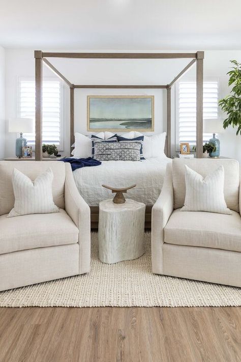 One of my favorite bedrooms! I love the light wood elements in the canopy bed and flooring, as well as the beautiful seating area with swivel chairs -- such a wonderful way to make the master suite feel more comfortable and inviting! bedroom ideas - master bedroom ideas - bedroom decor - bedroom furniture - bedroom design - modern coastal decor - modern bedroom ideas Salt Interiors, Modern Coastal Bedroom, Modern Guest Bedroom, Wood Canopy Bed, Cozy Bedroom Design, Bedroom Seating Area, Bedroom With Sitting Area, Pure Salt, Apartment Decoration