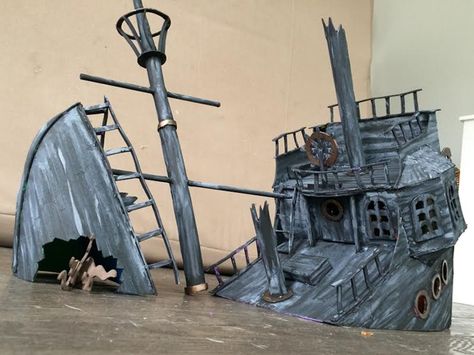 Pirate House Halloween, Diy Sunken Ship Under The Sea, Pirate Stage Design, Cardboard Shipwreck, Sinking Pirate Ship, Cardboard Pirate Ship Diy, Wrecked Pirate Ship, Pirate Ship Concept Art, Pirate Ship Wreck