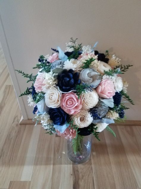 Navy blue is one very popular color for 2018 weddings. It pairs nicely with so many other colors. This bouquet features soft blush pink, grey and Ivory. Sola flowers make the perfect Keepsake bouquet. By Bride & Bloom  Gladwin,  MI 48624 Facebook.com/thebrideandbloom Blush Pink And Navy Blue Wedding Flowers, Navy Blue And Blush Pink Wedding Centerpieces Floral Design, Blush And Navy Floral Arrangements, Grey Color Schemes, Navy Blue And Blush Pink Bridesmaid Bouquet, Navy Blue And Blush Wedding Boquet, Flowers Wedding Bouquet, Prom Pics, Diy Wedding Cake