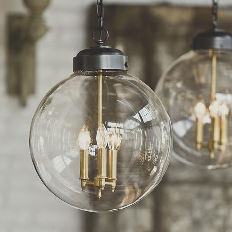 Clear Glass Globe Hanging Lantern- shades of Light. I like the brass candle holders with/in the bronze lantern. Also- 3 lights! Large Globe Pendant Light, Globe Pendant Light, Plywood Furniture, Kelly Wearstler, Globe Pendant, Hanging Lanterns, Globe Lights, Lighting Ideas, Southern Living