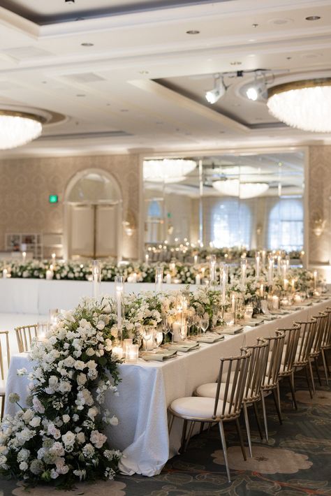 Long Table Wedding Reception Layout, High Table Design Wedding, White Flowers Reception, Vip Wedding Table, Rectangular Tables For Wedding Reception, White Florals Wedding Reception, Greenery Centerpiece Wedding Long Table, Wedding Floral Decor Reception Ideas, High Floral Centerpieces Wedding