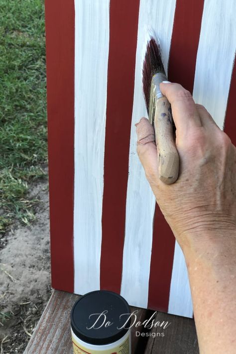 Red, white and blue on an DIY wooden American Flag sign. Flag Diy Projects, Wooden American Flag Decor, 4th Of July Porch Sign, Wood Flag Diy, Patriotic Porch Signs, Diy Wooden Candle, Beaded Candle Holders, Patriotic Porch, Wooden Candle Stand