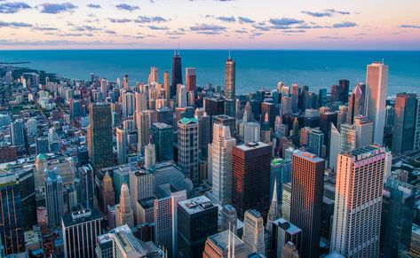 City architecture and skyscrapers near waterfront. Download this photo by Pedro Lastra on Unsplash Sumber Daya Alam, Chicago Downtown, Brown City, Old Route 66, Expensive Art, America Latina, Chicago Skyline, Sky View, Downtown Chicago