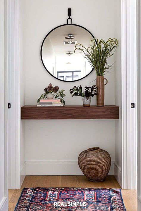 11 Hallway Decor Ideas to Elevate Your Space | Designer Becky Shea says a hallway is a perfect place to display a collection of items that are uniquely you. "Selecting items that subtly hint at your aesthetic in a pared-back manner is quintessential in achieving a look that feels thoughtfully curated," Shea explains. #homedecorideas #realsimple #decor #homeinspiration #detail End Of Hallway Accent Wall, End Of Hallway Ideas, End Of Hallway Decor, Small Hallway Decorating, End Of Hallway, Decorating Hallways, Narrow Hallway Ideas, Narrow Hallway Decorating, Upstairs Hallway