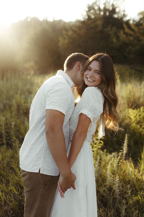 Shy Engagement Photos, Long Grass Couple Photoshoot, Simple Engagement Shoot, Prairie Engagement Photos, Flower Field Couple, Engagement Photoshoot Hairstyles, Engagement Pics In Field, Same Height Couples Poses Photo Ideas, Couple Poses Field