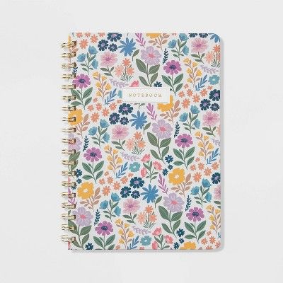 Freshen up your school and office supplies with this College-Ruled Journal in Ditzy Floral from Threshold™. This hardcover notebook features 192 double-sided, ruled pages for taking notes, making lists and more, while the elastic band helps to keep the book closed. Your daily note-taking gets a fun touch of style and shine thanks to the front glitter gold label that reads "Notebook," the vibrant floral-print cover on a white background and the gold-tone side spiral binding.  Threshold™: Quality Teacher Journal, Aesthetic Notebooks, College Notebook, Cute Spiral Notebooks, College Supplies, College School Supplies, Cute Notebooks, Gold Labels, School Essentials