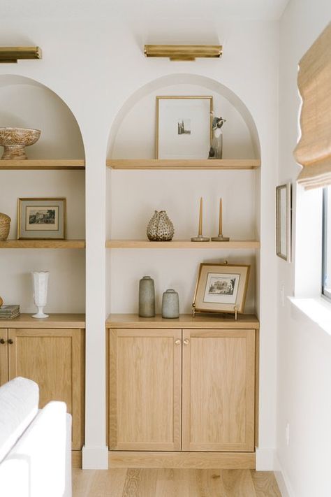 Double Arch Built Ins, Arched Built Ins Around Window, Built Ins High Ceiling Living Rooms, White Oak Built In Cabinet, Arched Alcove Shelves, Arch Recess In Wall, Arch Storage Wall, Arch Cupboard Design, Arch Shelf In Wall Built Ins