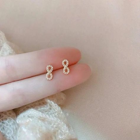 @MillieBaeBtq posted to Instagram: Classic & Chic, These Tiny Infinity Shaped Gold & Crystal Studs Are Sure To Be A Staple Accessory... #MILLIEBAEBOUTIQUE #wiwjewelry #wiw #wiwt #earringsoftheday #infinity #aboutalook #boutiqueshopping #boutiquefashion #smallbusiness #519shoplocal #smallbusinessowner #classics # #earringfashion #solopreneur #jewelry Symbol Earrings, Infinity Earrings, Infinite Love, Functional Fashion, Infinity Symbol, Classic Chic, Cz Stone, Silver Diamonds, Cute Earrings