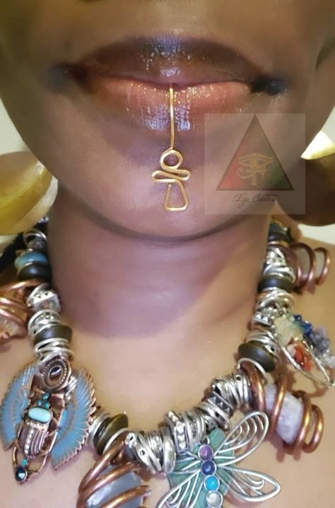 Our Ankh Lip Jewelry is a unique piece. No piercing is required. This item cannot fit into a pierced. This beautiful piece is an original design created by Eye Create LLC ™️ Lip Cuff Jewelry, African Piercings, Afrocentric Aesthetic, Create Llc, Ankh Jewelry, Lip Cuffs, Afrocentric Jewelry, Lip Jewelry, Lip Rings