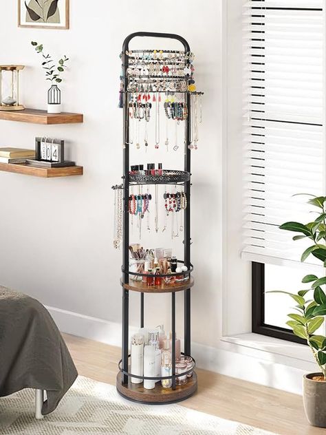 Upgrade your jewelry organization game with our versatile Floor Jewelry Holder Organizer. This rotating jewelry stand is designed to streamline your collection with dedicated holders for earrings, necklaces, bracelets, and rings. Its large hanging jewelry tree offers ample space to display and store your favorite pieces, keeping them easily accessible and tangle-free. Say goodbye to clutter and hello to organized elegance with this stylish and practical storage solution. Earring Storage, Necklace Organizer, Earring Organizer, Necklace Holder, Hanging Jewelry, Necklace Display, Practical Storage, Bracelet Ring, Jewelry Tree