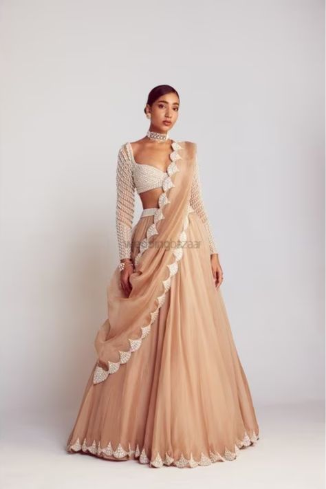 Presenting you latest Indian Engagement Outfit ideas for Bride & Groom. From gowns to simple lehengas, we have got variety of engagement outfits. #weddingbazaar#indianwedding #engagementoutfits #engagementoutfitsindian #engagementoutfitsindiansimple #engagementoutfitsindiangown #engagementoutfitsindiansaree Beige Lehenga, Sweetheart Blouse, Vani Vats, Simple Lehenga, Trendy Outfits Indian, Organza Lehenga, Indian Outfits Lehenga, Pearl Chandelier, Lehenga Designs Simple