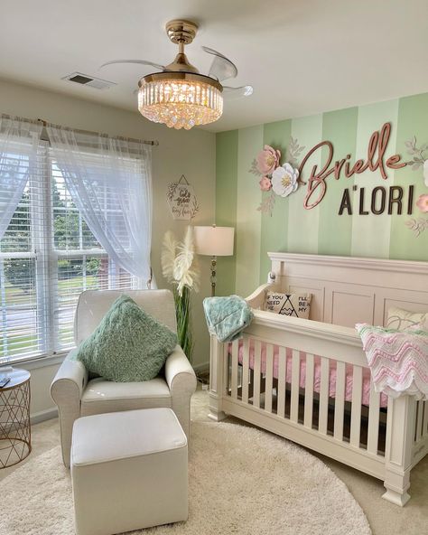 Mint green striped focal wall with name accent. Boho themed nursery decor with a touch of glam. Green Nursery Pink Accents, Mint Green Nursery Girl, Pastel Green Nursery, Pink Nursery Colors, Chic Baby Nursery, Boho Themed Nursery, Green Nursery Girl, Nursery Dark Furniture, Green Baby Nursery