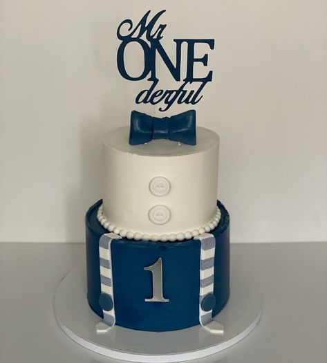 Mr. Onederful💙 Celebration cake for a ONEderful first birthday! 💙Flavour: Dunkaroo 💙 @mccallsbakers Gel food colours and fondant 💙 @starcreations.to Cake toppers 💙 @gayleafoodscoop #firstbirthday #first #birthdayboy #one #onederfulbirthday #blueandwhite #navyblue #bowtie #birthday #birthdaycake #twotiercake #suspenders #babyboy #boystyle #cakes #bramptonbaker #brampton Mr Onederful Birthday Cake Topper, Mr Onederful Birthday Cake Smash, Mr Onederful Birthday Decoration, Mr Wonderful 1st Birthday, Mr Onederful Birthday Cake, Mr Onederful Birthday, Onederful Birthday, Mr Onederful, Baby Birthday Decorations