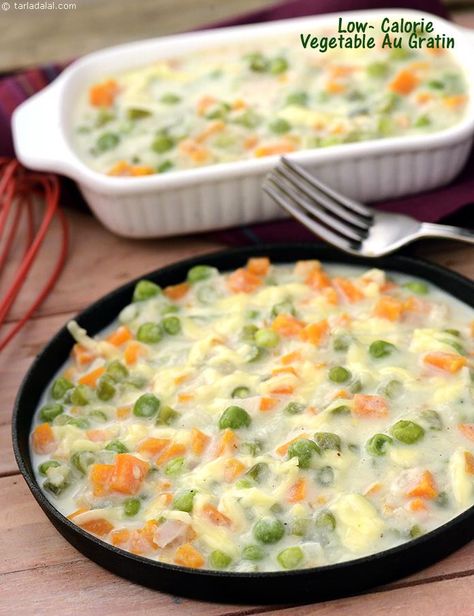 A healthy version of vegetable au gratin. The veggies are cooked in a creamy sauce in which the creamy texture is retained by the use of low calorie white sauce made with cauliflower puree instead of high fat butter. Indian Healthy Recipes, Food Recipes In Hindi, Continental Cuisine, White Sauce Recipe, Low Calorie Vegetables, Au Gratin Recipes, White Sauce Recipes, Masala Sauce, Cauliflower Puree