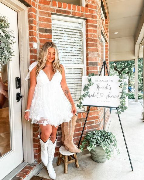 Bridal Shower 7.13.2024 - Boots & Bubbly 👢🫧 • Dress - @selfie_leslie Boots - @willowchicboutique Necklace - @smilebelleofficial • #bridalshower #bridalshowerideas #bridalshowerdress #bride #bridestyle #bridesofinstagram #dfw #dallastexas #trending #trendingnow #viral #fyp #explorepage✨ #cuteoutfits #summerdress #whitedress #bootsandbubbly Wedding Dress And White Boots, Bridal Shower Outfit For Bride Western, After Wedding Bride Outfit, Short Wedding Dress With Cowgirl Boots, Reception Dress Country, Cowgirl Wedding Reception Outfit, Wedding Reception Dress For Bride Country Cowgirl Boots, Western Wedding Dresses Short, Short Wedding Dress Cowboy Boots