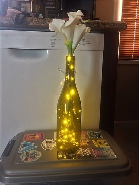 Flowers In Wine Bottles, Light Centerpieces, Wine Bottle Flowers, Wine Bottle Lights, Bottle Flowers, Wine Bottle Centerpieces, Lighted Centerpieces, Bottle Centerpieces, Vase With Lights