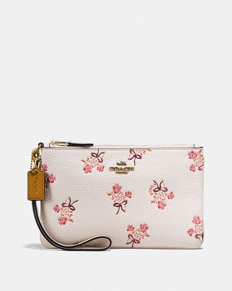 SMALL WRISTLET WITH FLORAL BOW PRINT Coach Wristlet Wallet, Small Wristlet, Bow Print, Handbag Collection, Bow Bag, Girls Handbags, Luxury Purses, Coach Wristlet, Timeless Gifts