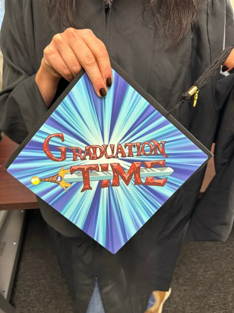 "Info \"Adventure time, C'mon, grab your friends, We'll go to very distant Lands, With Jake the Dog, and Finn the Human, The Adventures'll never end, It's Adventure Time!\" About A Tassel Topper is the ultimate form of self expression and is the professional way to decorate your graduation cap. We print your design on a durable sheet of plastic that fits directly on top of your graduation cap with the help of our adhesives. The Tassel Topper won't damage your grad cap in any way and is a sure wa Graduation Cap Adventure Time, Fortnite Graduation Cap, Regular Show Graduation Cap, Adventure Time Grad Cap, La La Land Graduation Cap, Graduation Cap Designs Art Major, Coraline Grad Cap, Avatar Graduation Cap, Coraline Graduation Cap