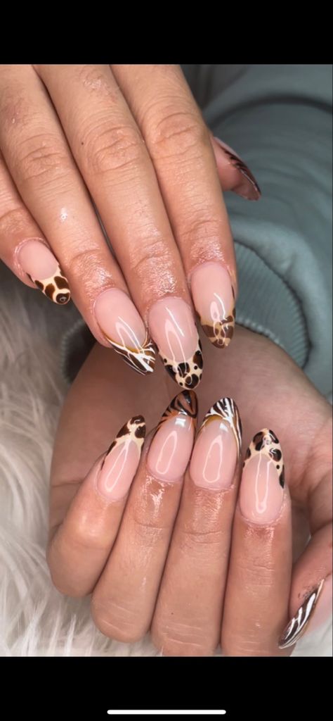 french tips, brown french tips, animal print nails, cheetah nails, zebra mails, giraffe nails, tiger nails, zoo print nails, fall nails, y2k nails, trendy nails, brown french tips, zebra french tips, multicolor french tips, ombre french tips, gelx nails, nude nails, hailey bieber nails, trending nails, detailed nails, nail art, nail inspo, almond nails Giraffe French Tip Nails, Zoo Nails Animals, Simple Animal Print Nails, Animal Print Nails French Tip, Tiger French Tip Nails, Brown Zebra Print Nails, Leapord Print Nails French, Nails Ideas Cheetah, Leo Nail Ideas