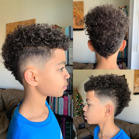 Burst fade mohawk with biracial hair.        (Cut by Drew at Mari’s Barbersalon in Indianapolis, IN) Curly Hair Mohawk Fade, Biracial Mens Haircut, Mixed Kid Haircut, Mohawk Boys Curly Hair, Curly Faux Hawk Boy, Fohawk Haircut Fade Curly, African American Boys Haircut Trendy, Haircuts For Mixed Boys Curly Hair, Mohawk Curly Hair Men