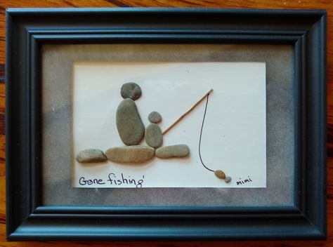 Country/Region of Manufacture:	United States  Theme:	Father Son	  Style:	Art Deco  Type:	Pebble Art	  Item Height:	5 inches  Item Length:	7 inches	  Product Line:	Pebble Art by Mimi  Brand:	Handmade  This picture features the Pebble Art of a Father & Son fishing. "Gone Fishing" is printed underneath.  This work of art is fitted into a 5 x 7 inch frame that can be hung or set on a table.  Other artists use paint, fabric, wood or metal, Mimi uses pebbles as a medium. Stone Pictures Pebble Art, Art Deco Theme, Wall Home Decor, Style Art Deco, Stone Pictures, Gone Fishing, Rock Crafts, Pebble Art, Stone Art