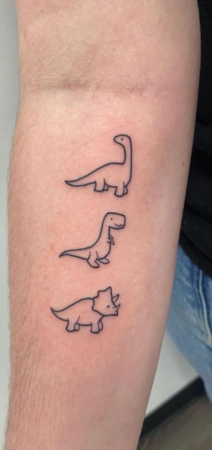 125 Dinosaur Tattoo Designs for the Dino Devotee - Tattoo Me Now Small Dino Tattoos Matching, Simple Tattoos Dinosaur, Trex Mini Tattoo, Pb And J Tattoo Best Friends, Three Dinosaur Tattoo, Dinosaur Tiny Tattoo, Fresh Tattoo Ideas, Dino Tattoos Cute, Family Dinosaur Tattoo