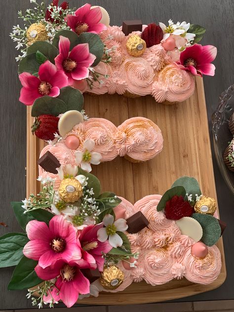 Letter Pull Apart Cupcakes, Pull Apart Cupcake Cake Letters, Letter Cupcakes Ideas, Fall Baby Shower Cupcakes Girl, Boho Baby Shower Cupcakes Girl, Baby Shower Pull Apart Cupcakes, Letter Cupcake Cake Pull Apart, Wildflower Baby Shower Cake, Sprinkle Themes